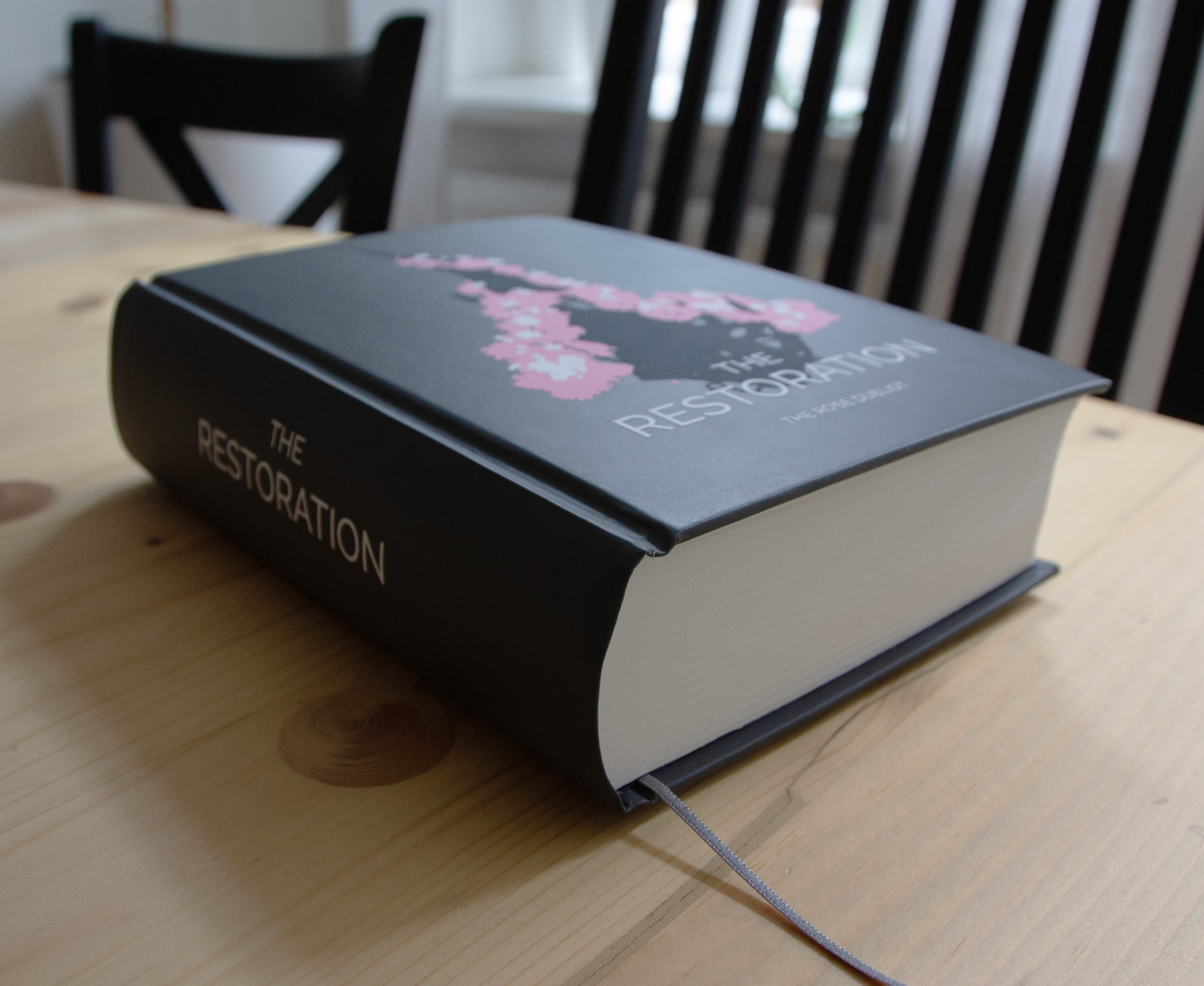 A shot of the book from the side, featuring the spine.