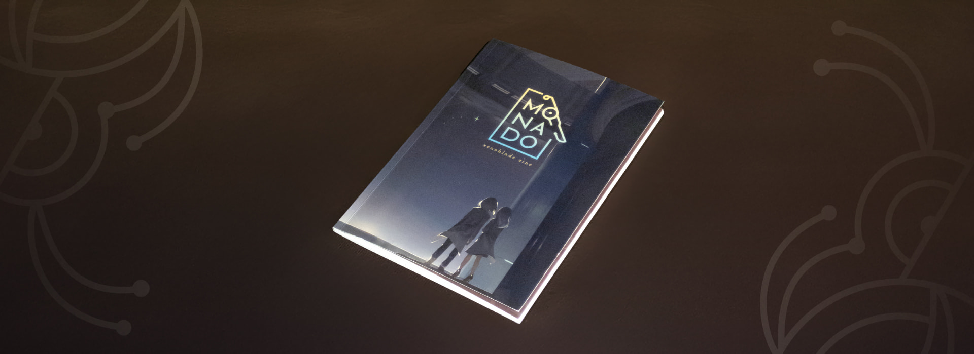 A shot of the Monado Zine laid flat, surrounded by graphic elements.