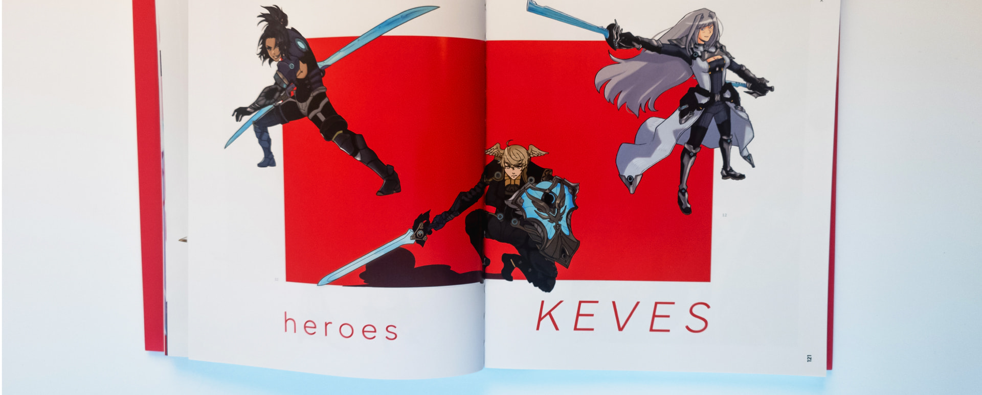 A spread in the book with character arts on a bright color background and typography.