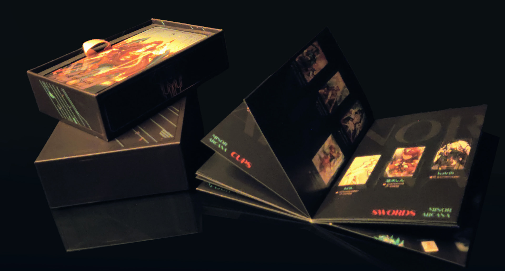A shot of the info/credits booklet mid flip next to the card box set.